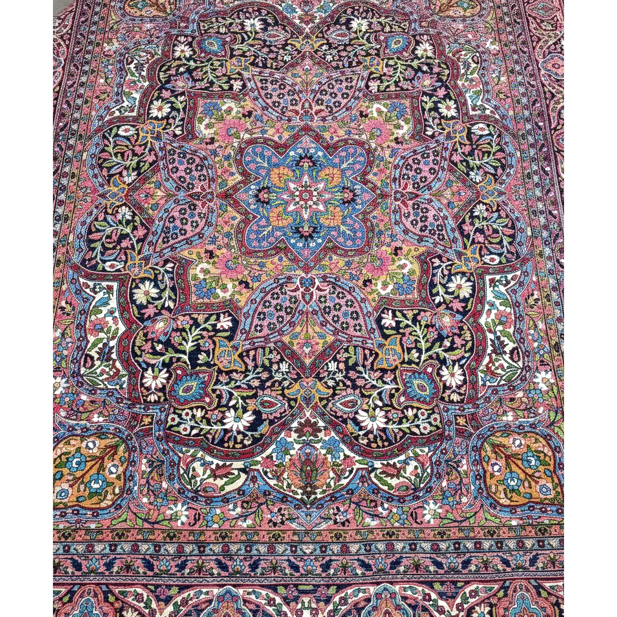 Detailed view of a corner of the multi-color rug