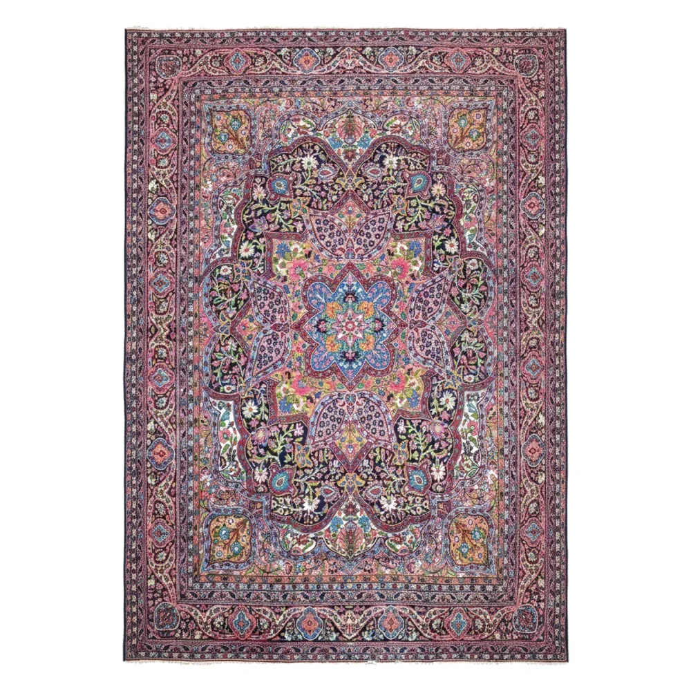 Full view of a large rectangular area rug featuring a vibrant central medallion and dense floral pattern.