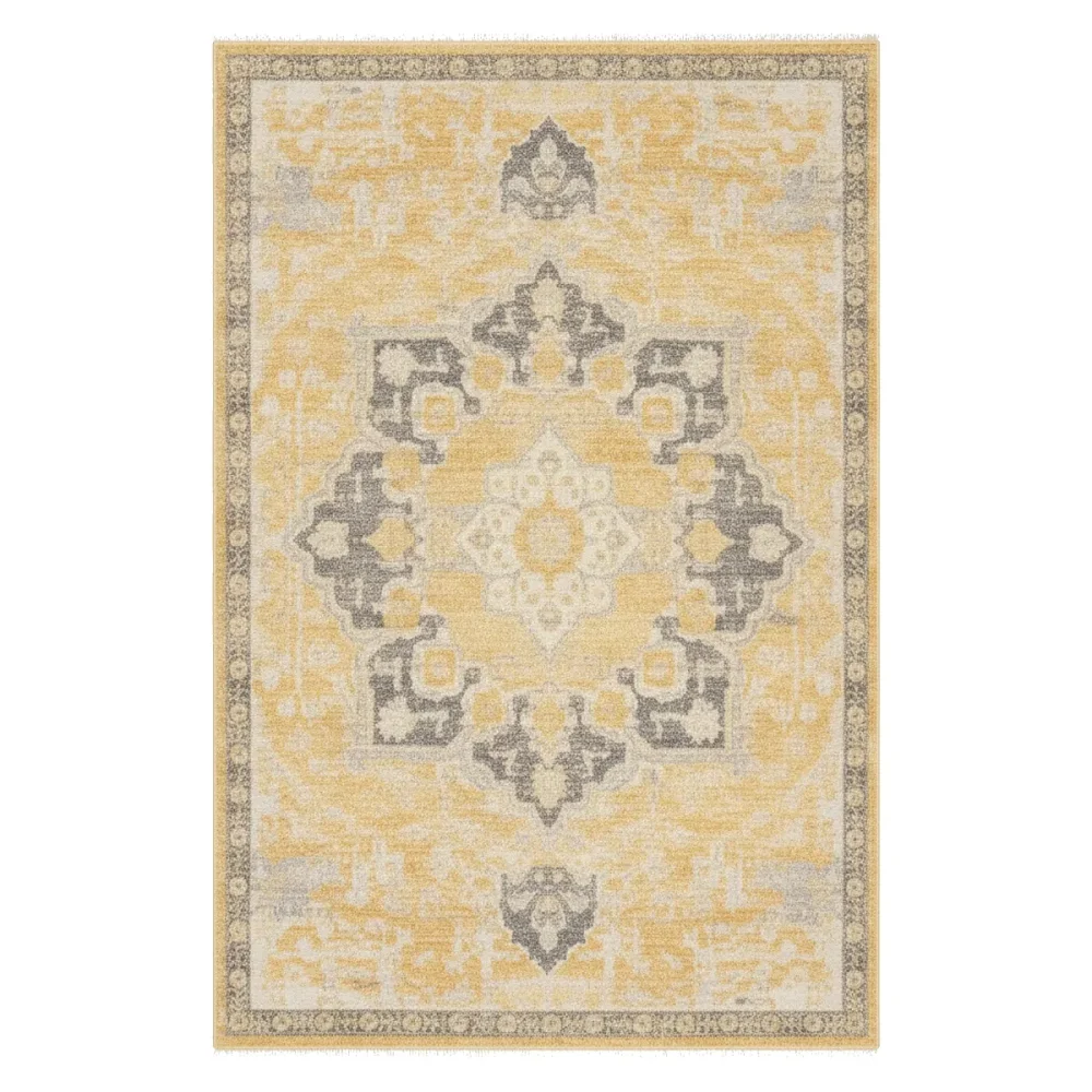 Close-up view of a modern rectangular area rug with a distressed yellow
